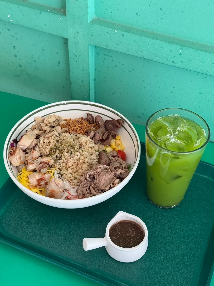 A poke bowl filled with colorful vegetables and toppings