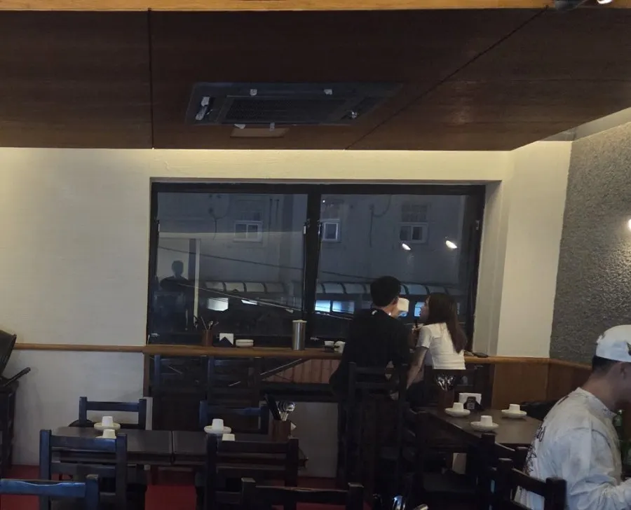 Window-side bar table seating at Hyehwahwa