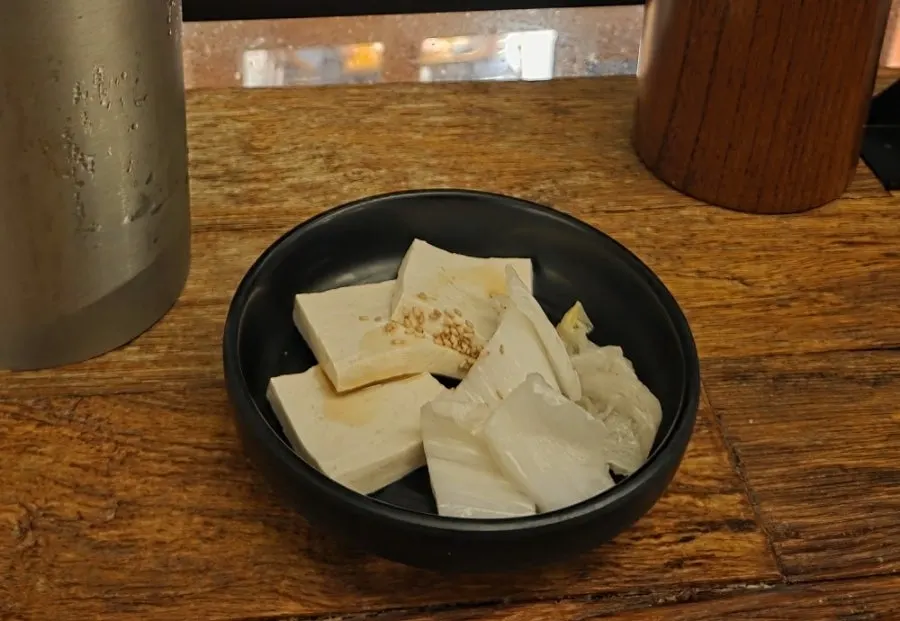 Complimentary tofu with white kimchi