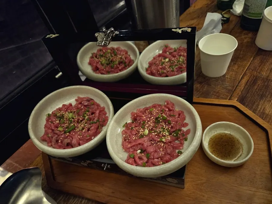Beef tartare and aged-kimchi egg kimbap served in a mother-of-pearl box