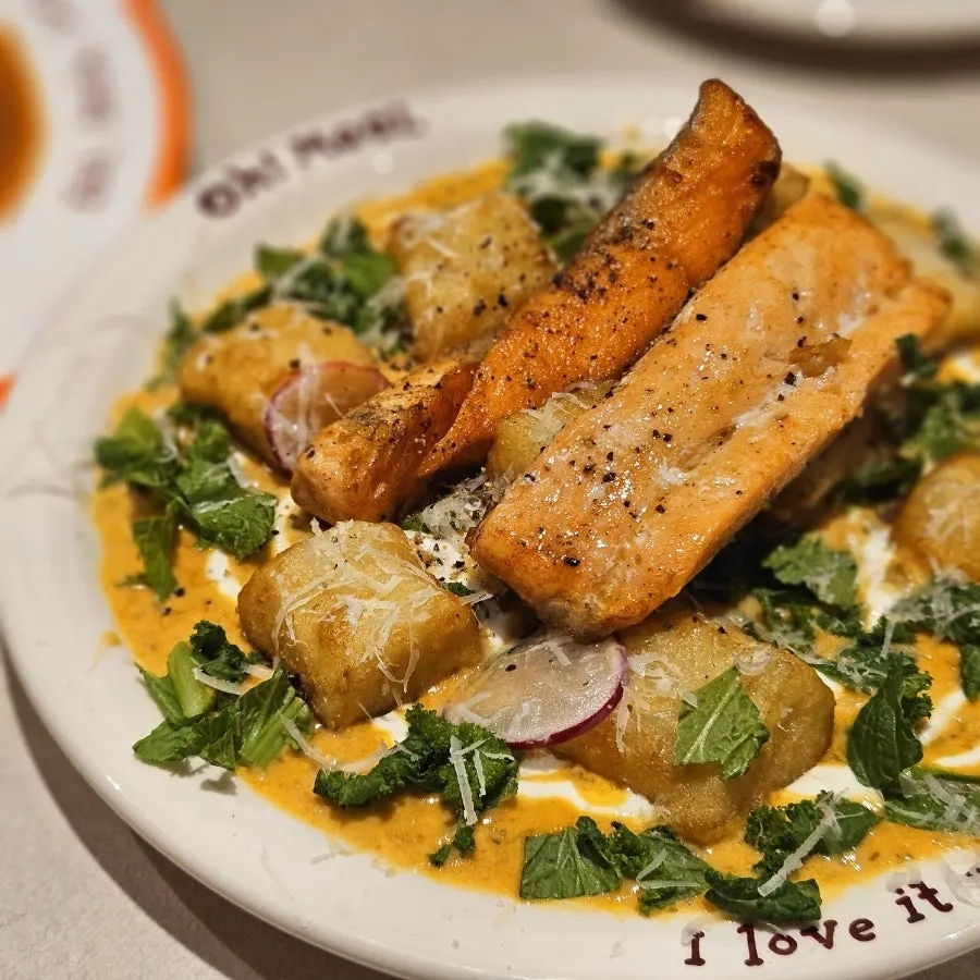 Gnocchi and grilled salmon in cream sauce