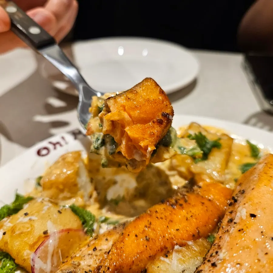 Close-up cross-section of gnocchi with extra salmon