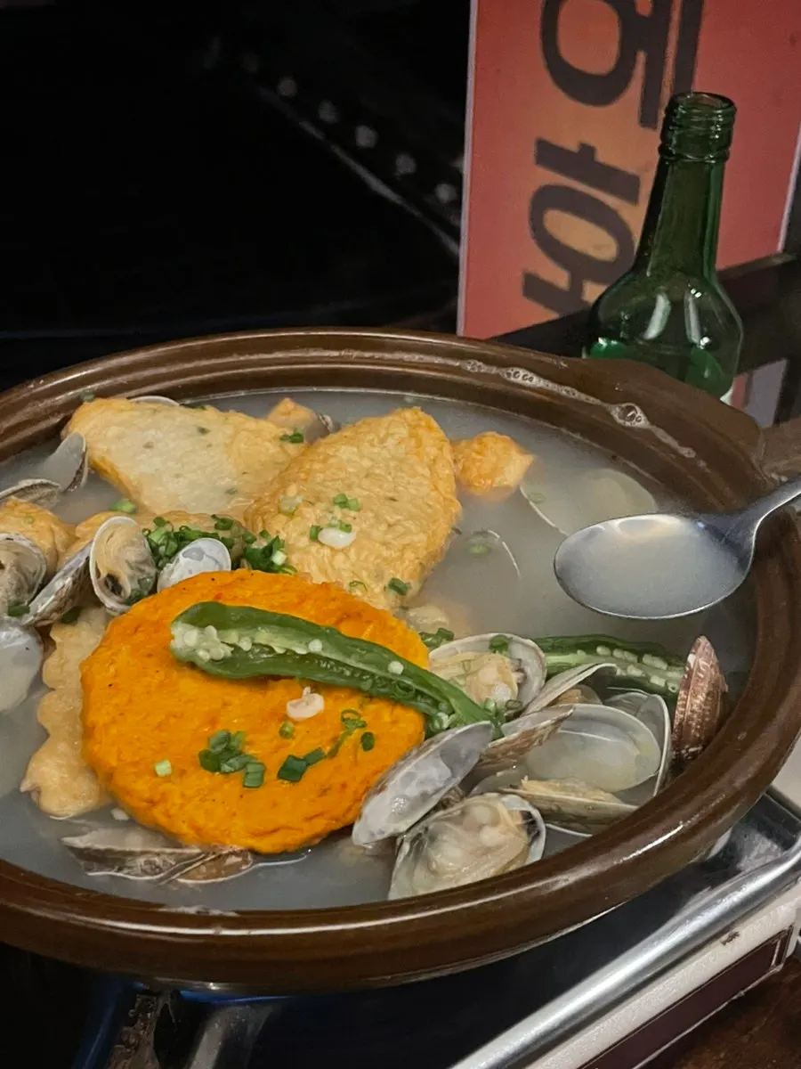 Fish cake stew broth loaded with clams