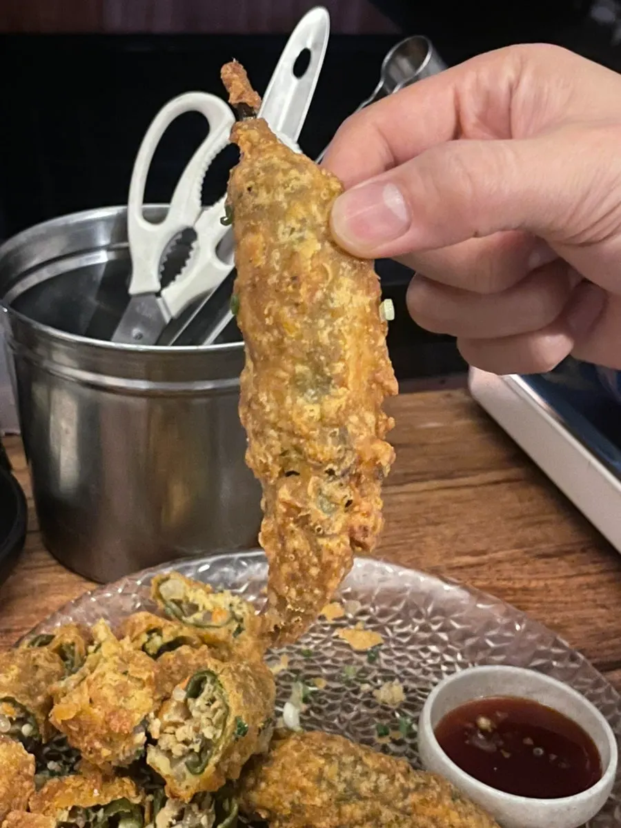 Cross-section of fried pepper packed with glass noodles and meat