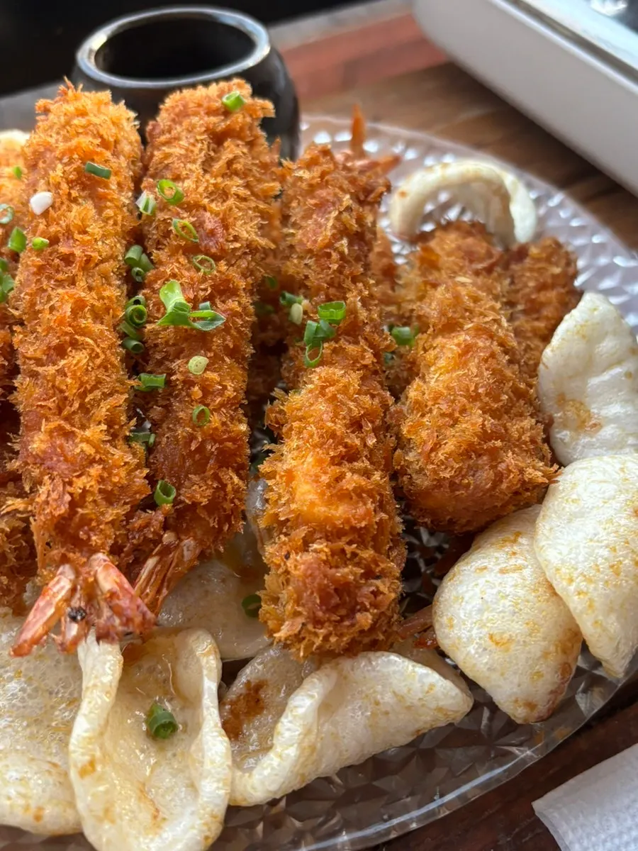Table spread with crispy shrimp and gopdori-tang