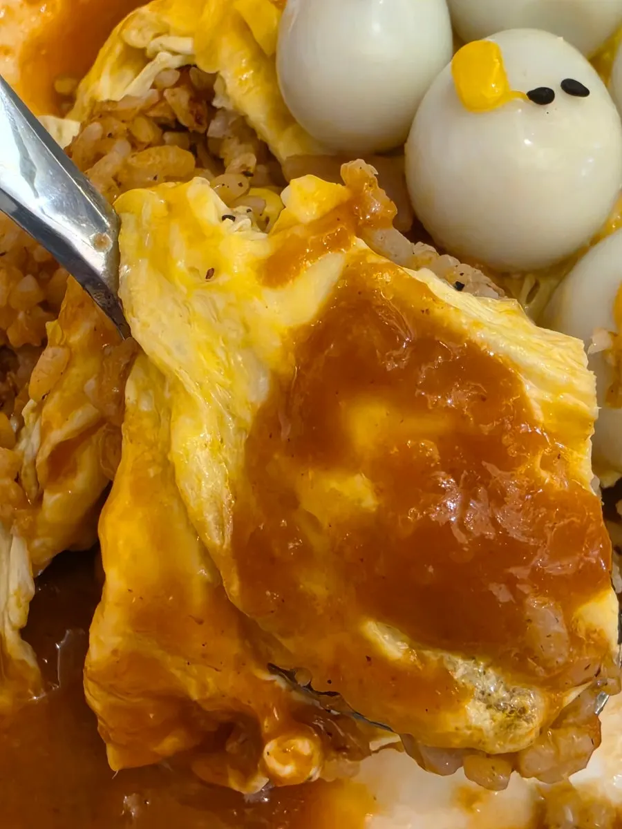 Fried rice topped with small duck-shaped quail eggs