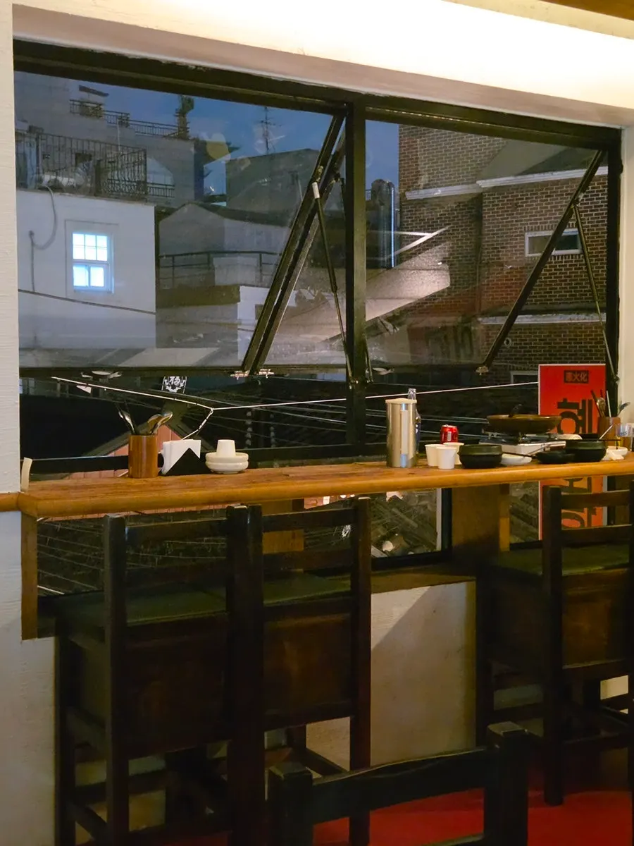 Wood-tone interior of Hyehwahwa decorated with rice straw