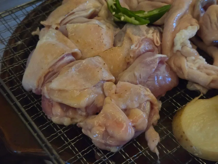 Whole gopchang and chicken thigh after searing