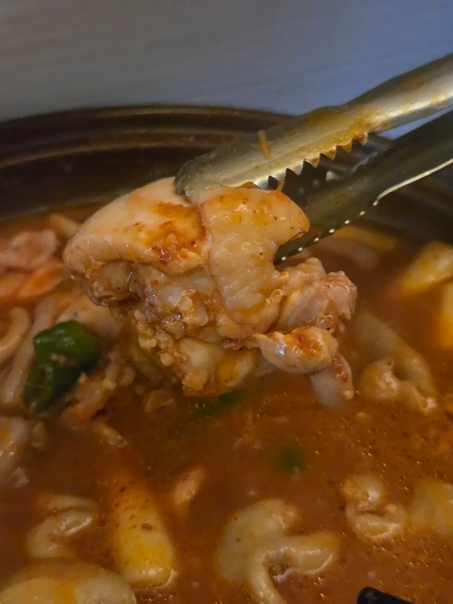 Whole gopchang in the gopdori-tang after the broth has thickened