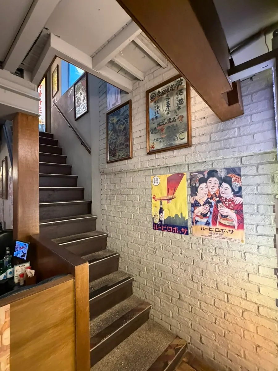 Interior with bar seating and an open kitchen