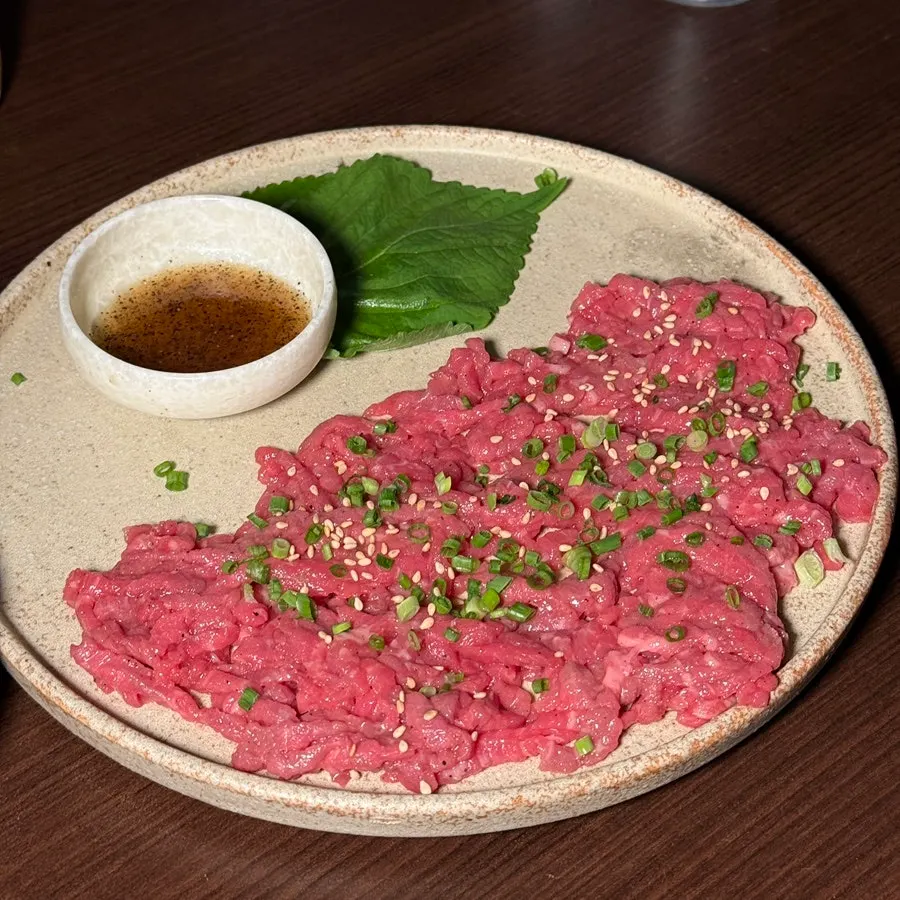 A full spread of Hyehwahwa's premium Korean beef tartare, half plate