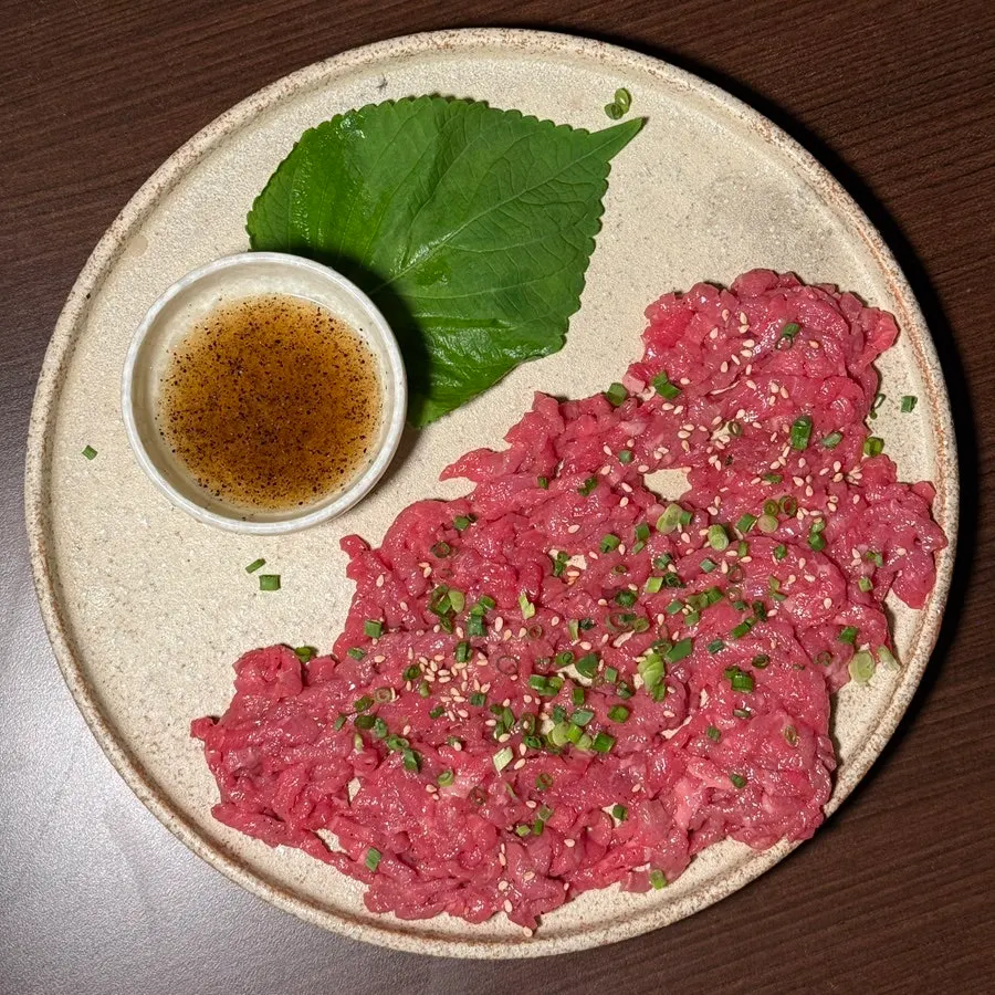A generous portion of chilled Korean beef tartare, half plate