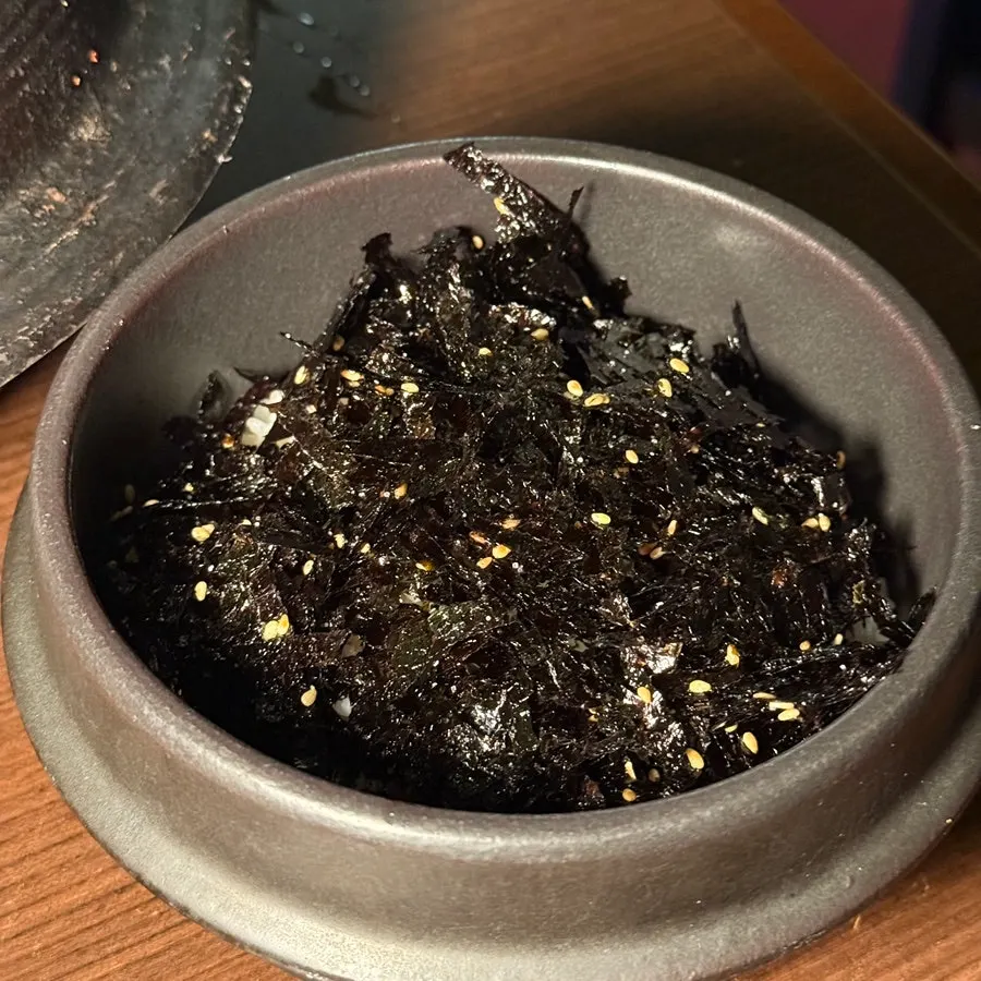 A rice bowl piled high with seaweed flakes
