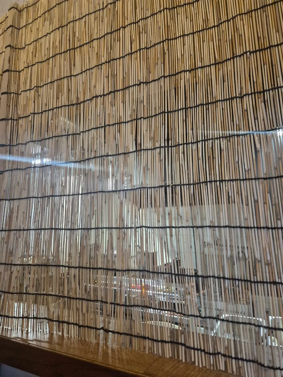 Cooking with burning straw to infuse ingredients with smoky char