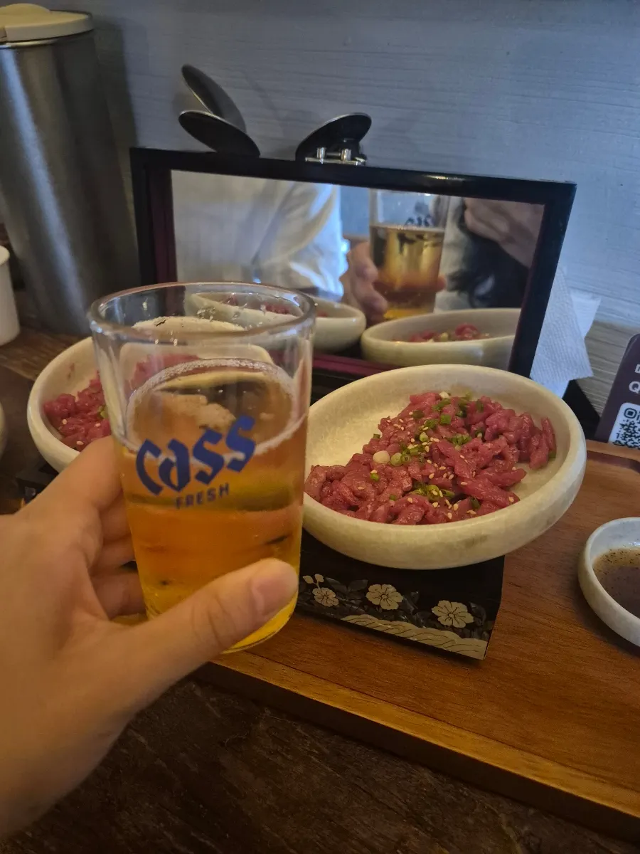 A glass of Kelly beer served alongside the food