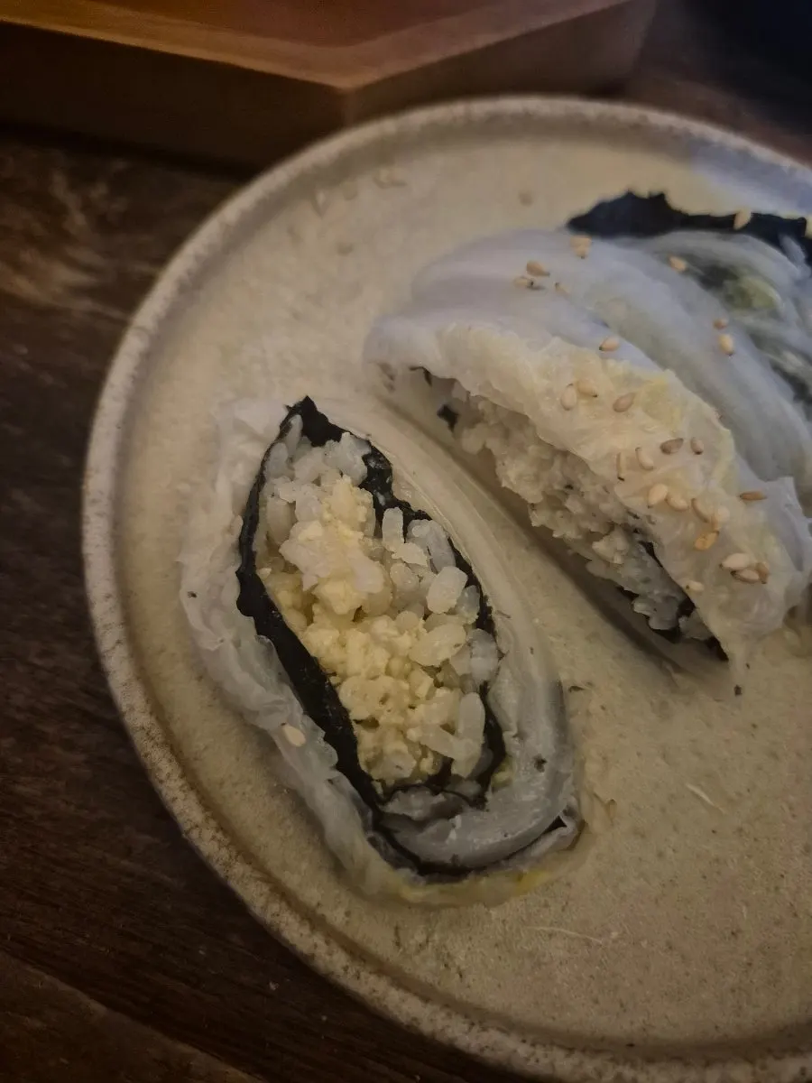 A single piece of aged kimchi egg sushi