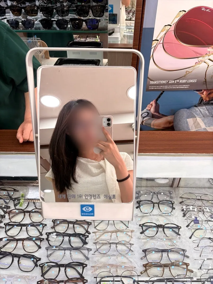 Wearing the bold deep brown frames