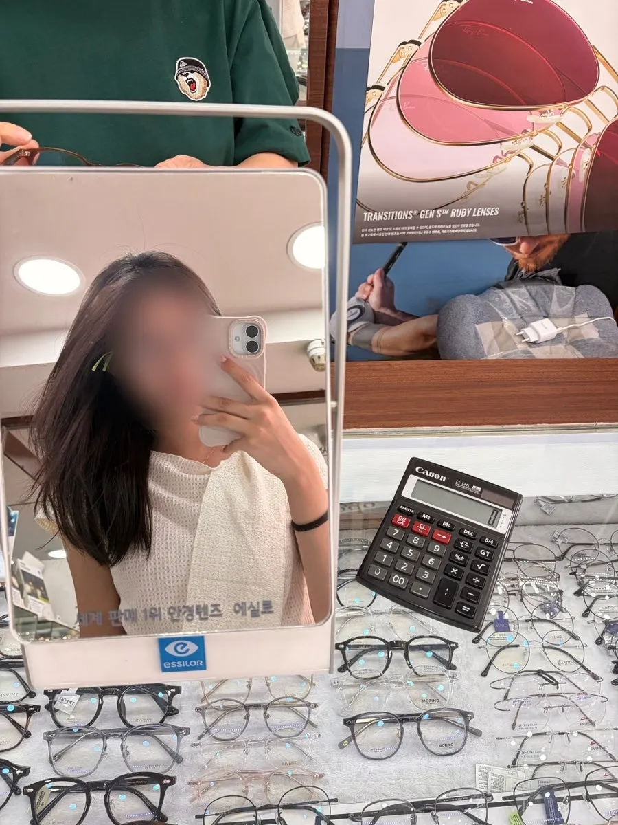 Wearing the thin brown frames