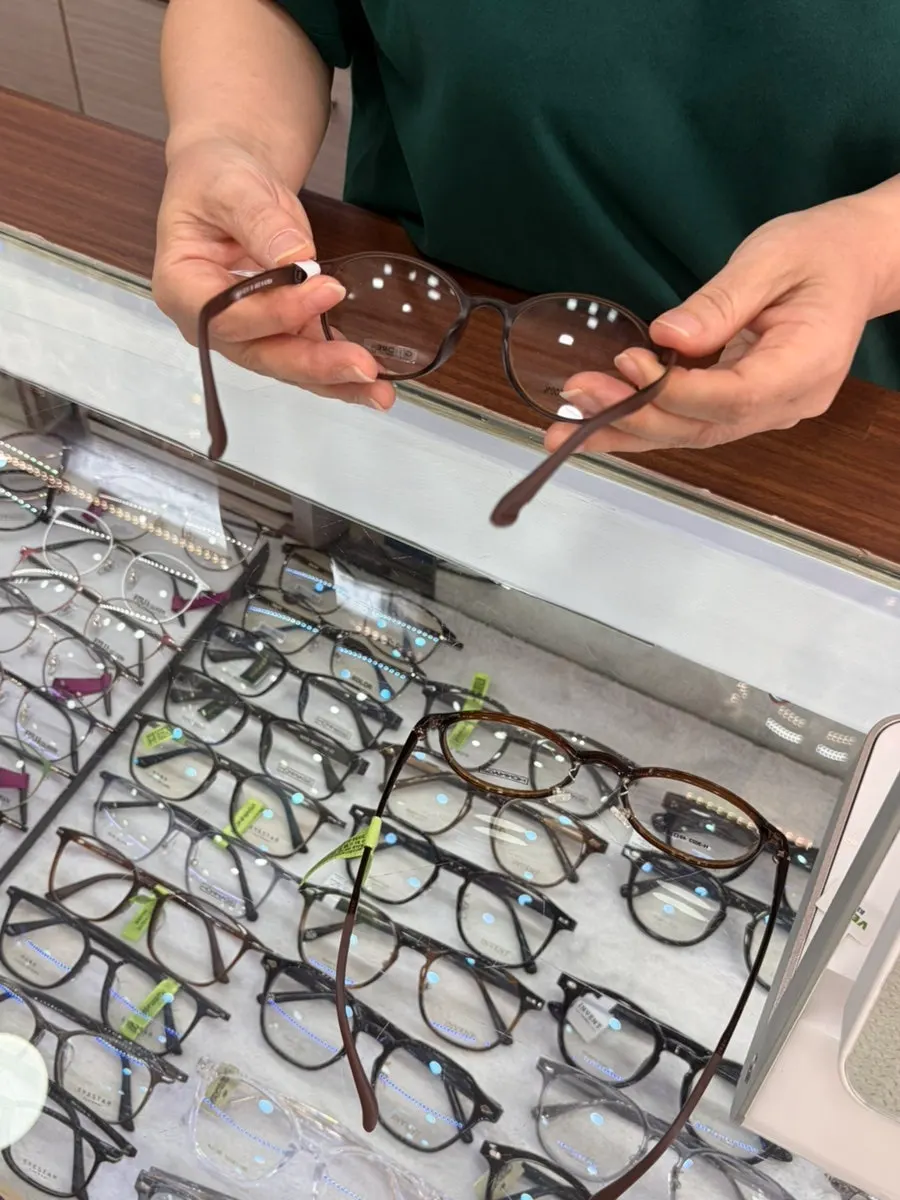 Optician pressing the temple to fit the frame