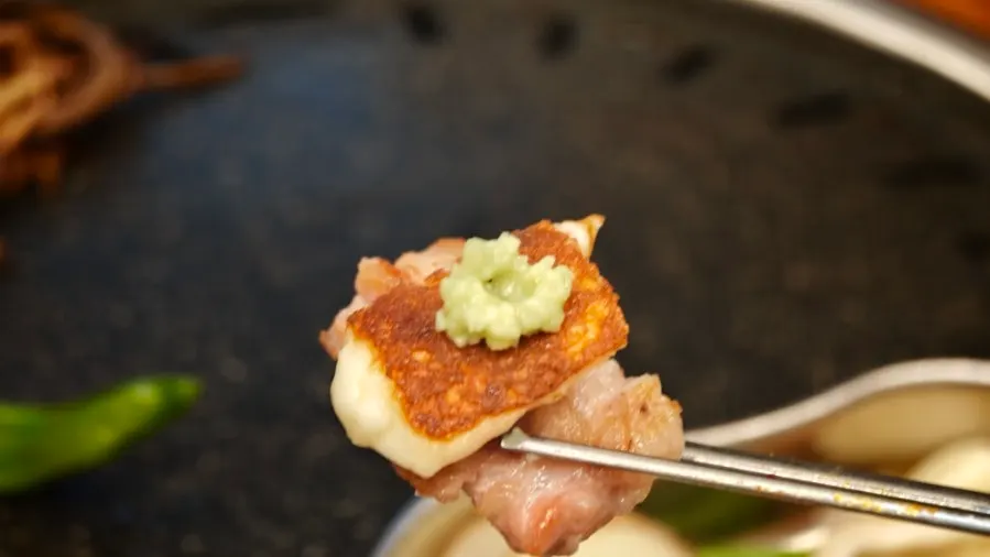 Plate of raw pork belly, pork neck and pork ribs ordered together