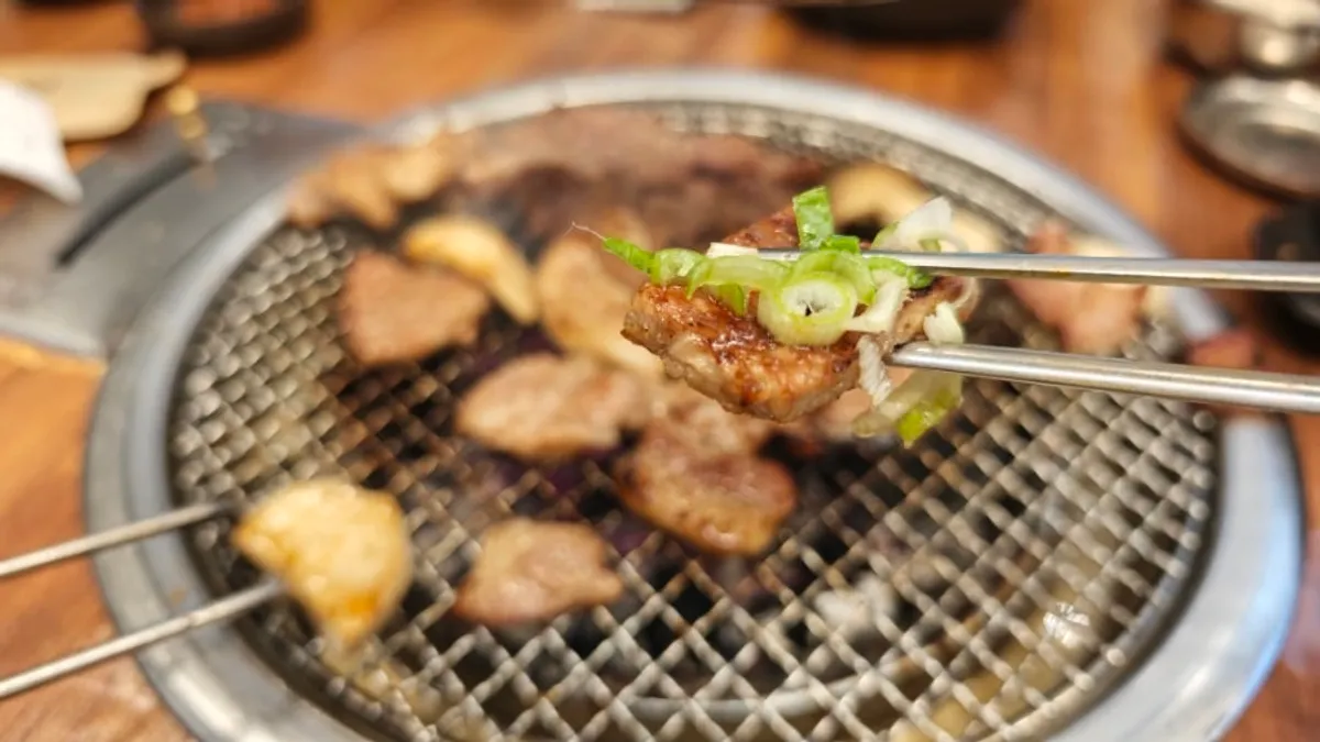 Golden-grilled pork belly with grilled bracken fern