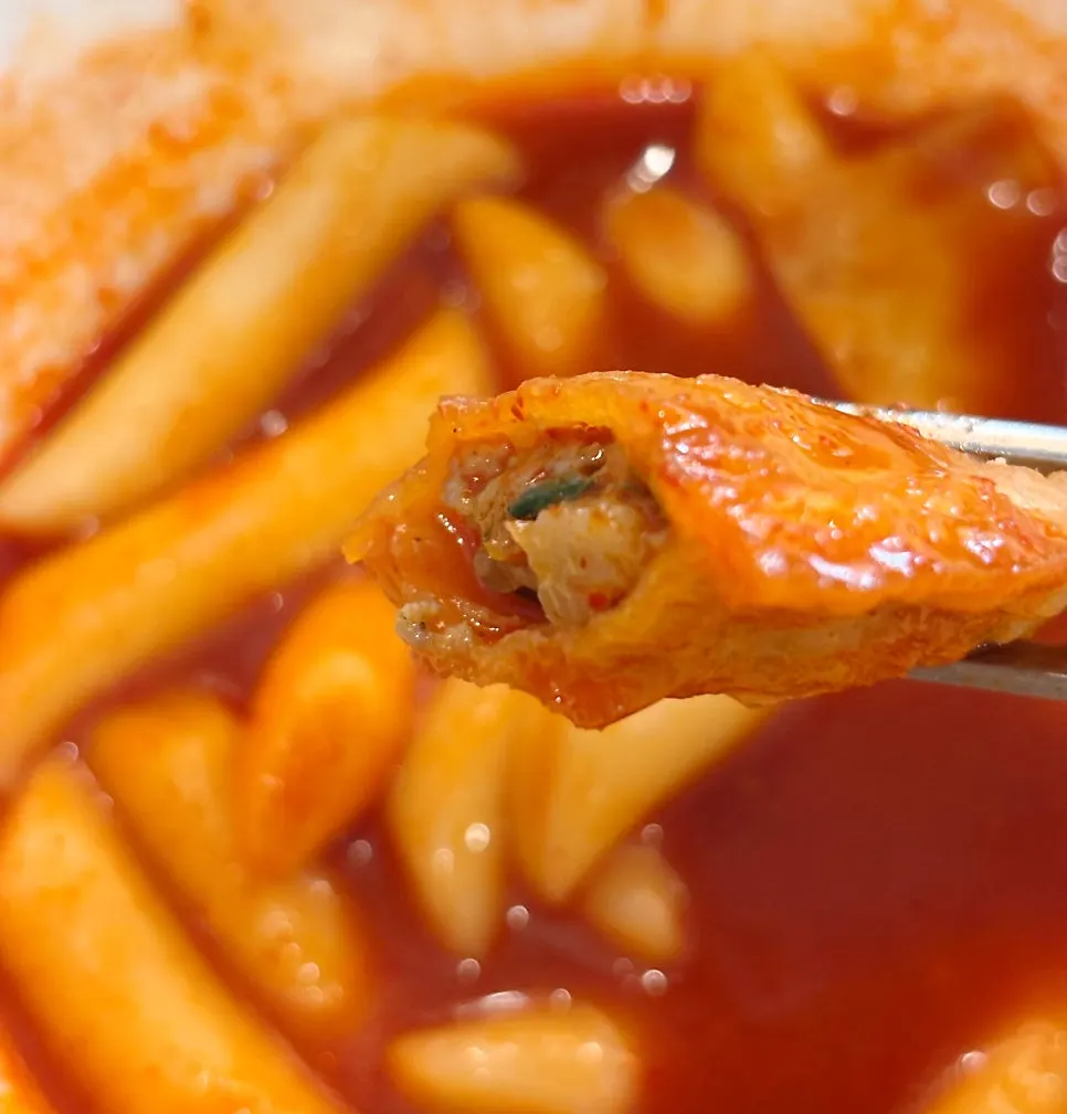 A fritter dipped in tteokbokki broth
