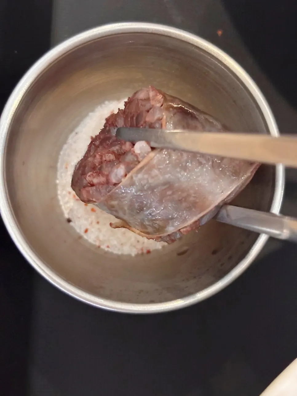 Dipping sundae into the tteokbokki broth