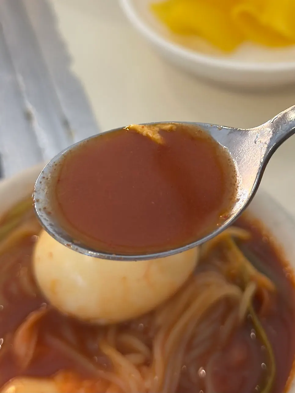 Rice cake and egg lifted out of the instant tteokbokki