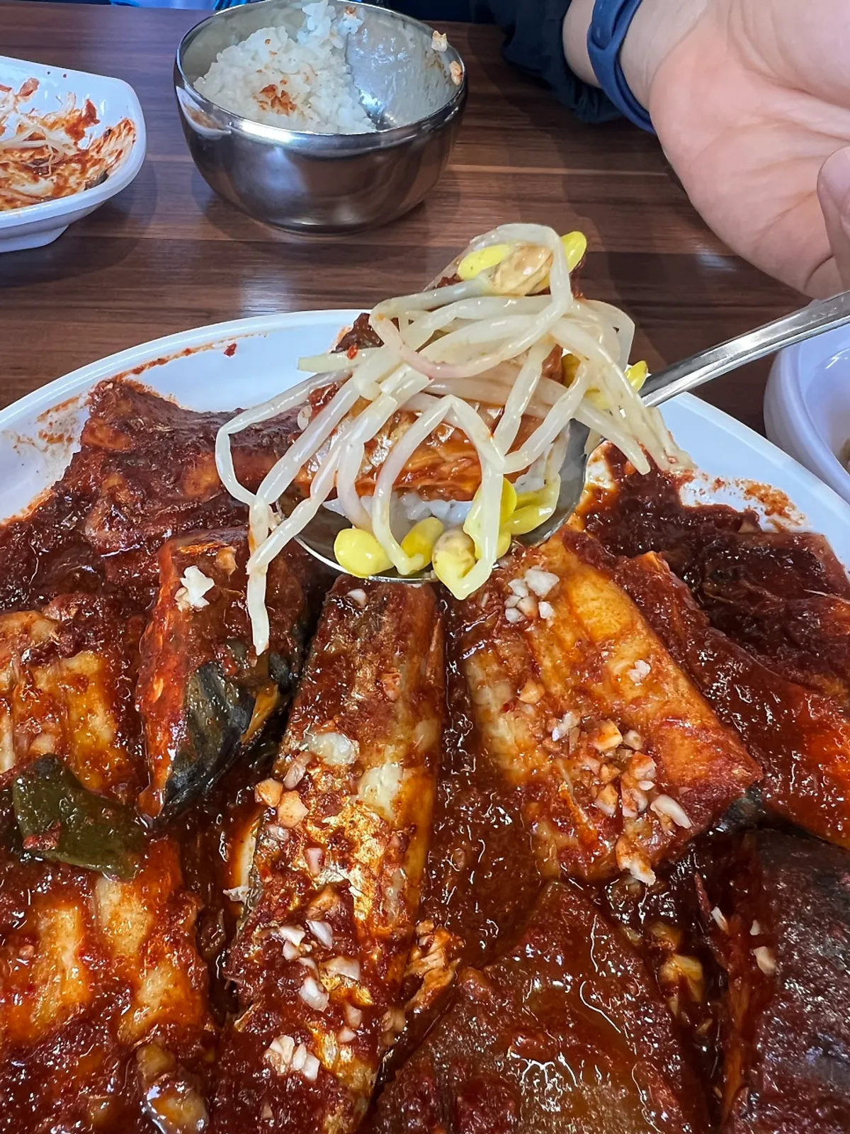 A bite of seaweed wrapped with rice and fish flesh