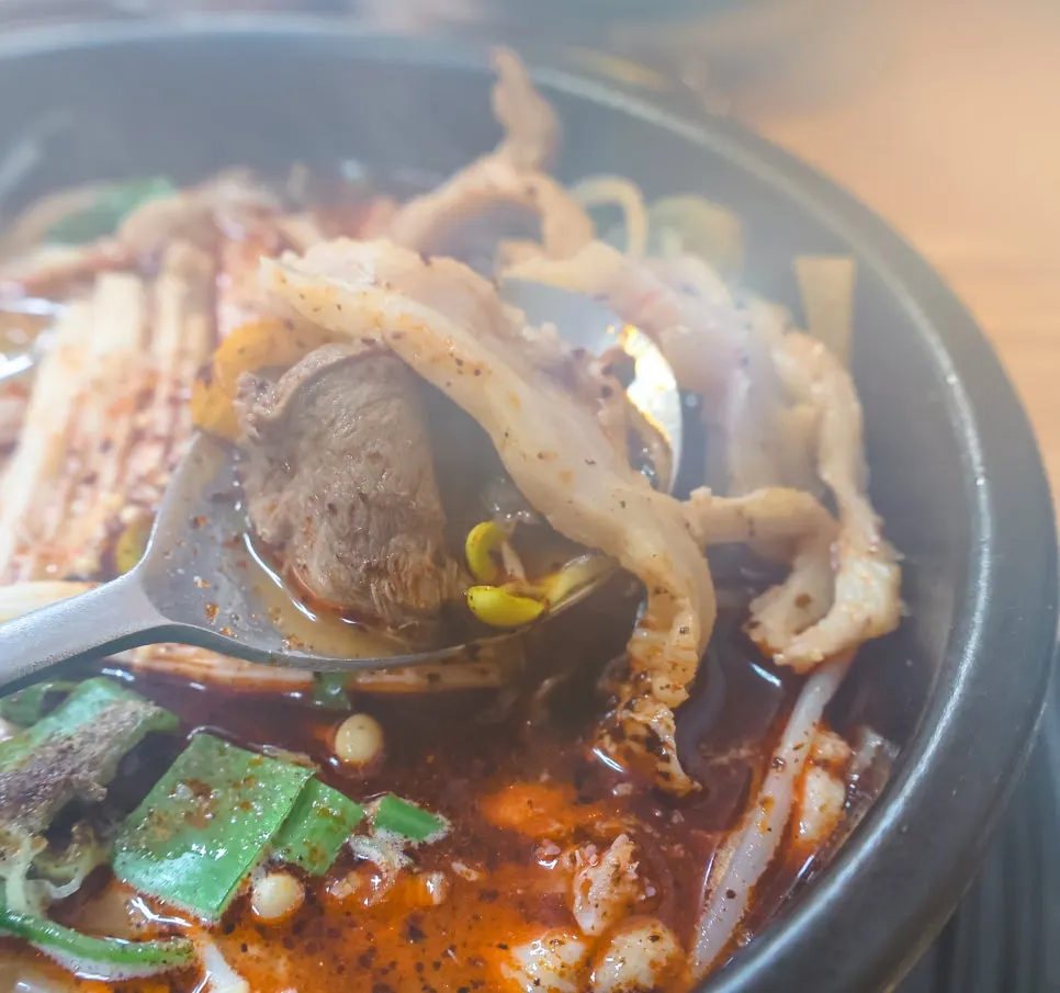 Tripe and meat packed inside the tripe soup bowl