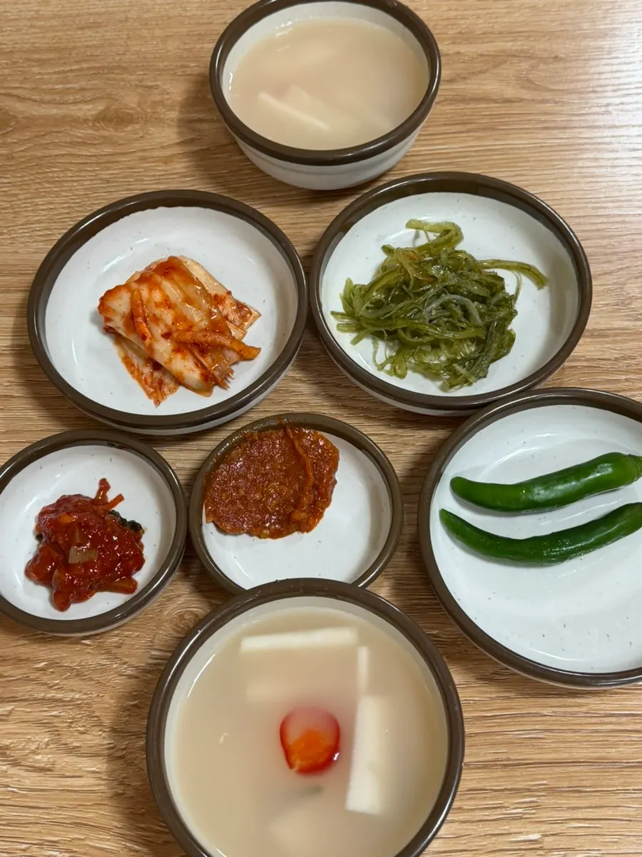 Bowl of dongchimi with radish and red chili