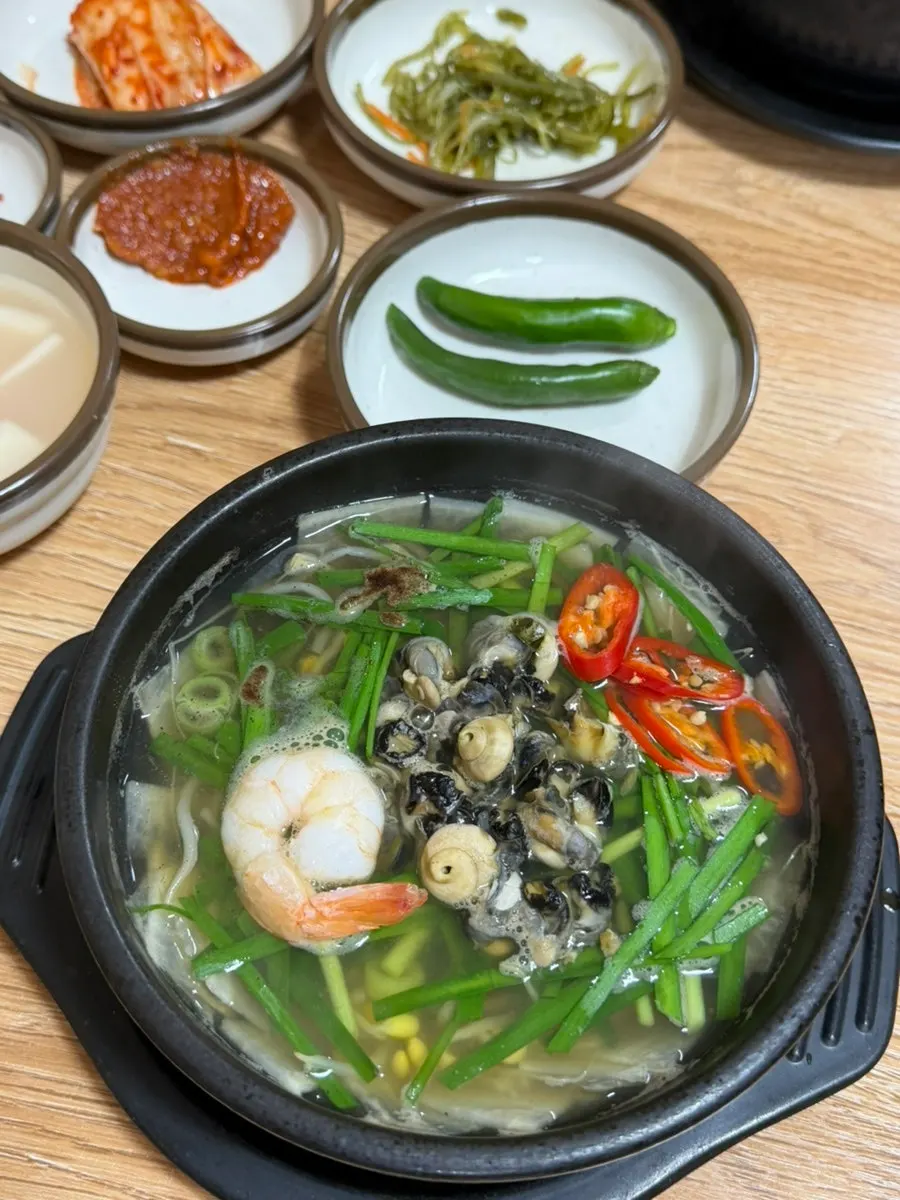 Chewy sea snails scooped up with a spoon