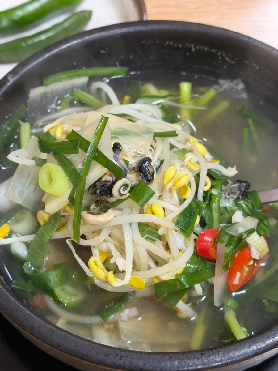 A bowl of sea snail haejangguk with rice mixed in