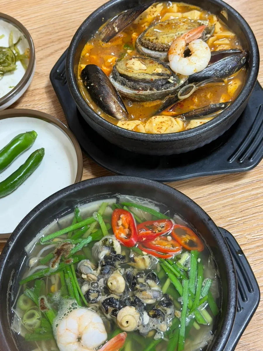 Tender abalone meat scooped out with a spoon