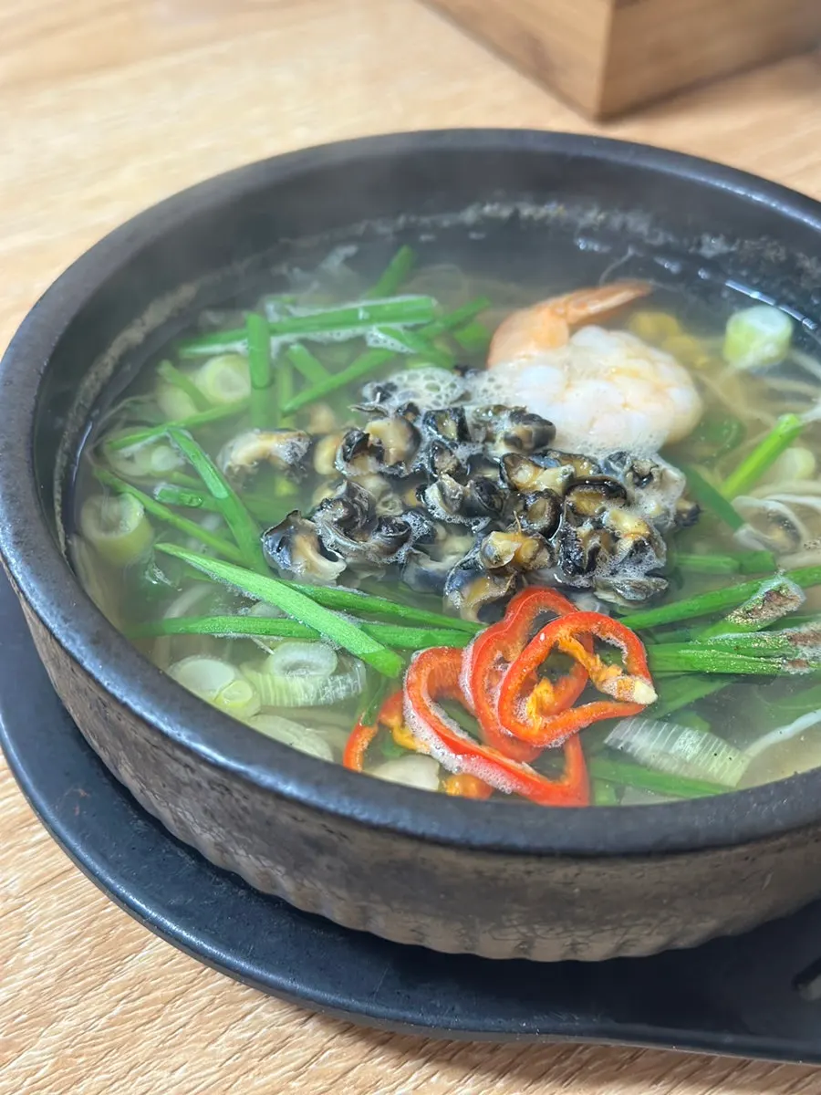 Jeju Hyeopjae bepokjaengguk in an earthenware bowl