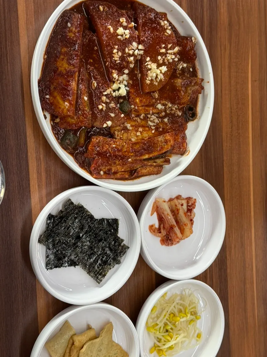 Stew meal served with side dishes