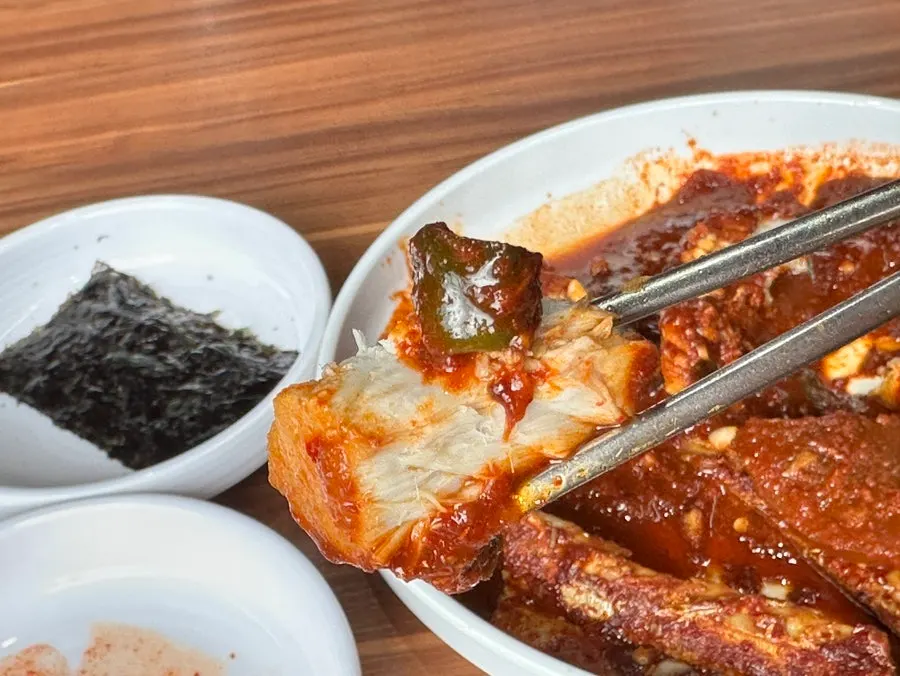 Well-braised jorim radish scooped up with a spoon