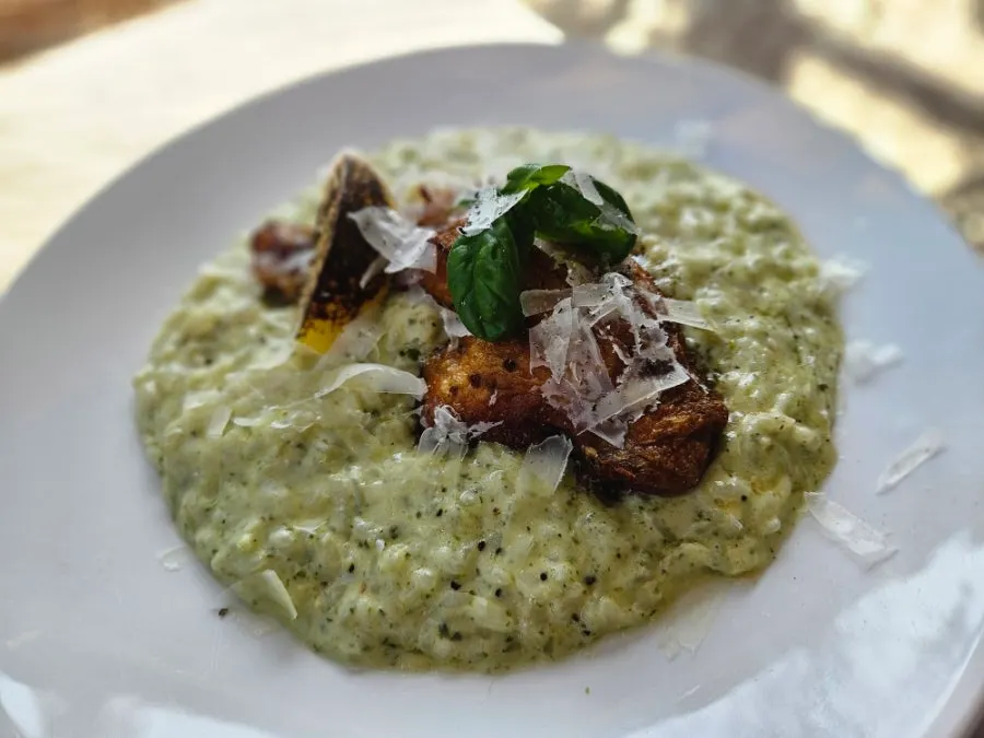 A plate of basil pesto chicken risotto