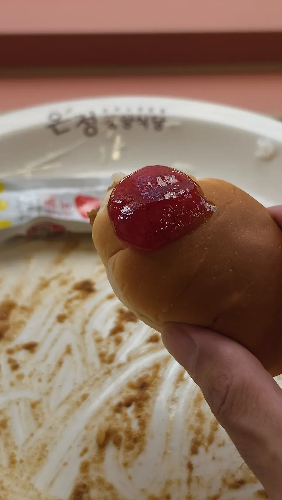 Morning bread and strawberry jam served for dessert