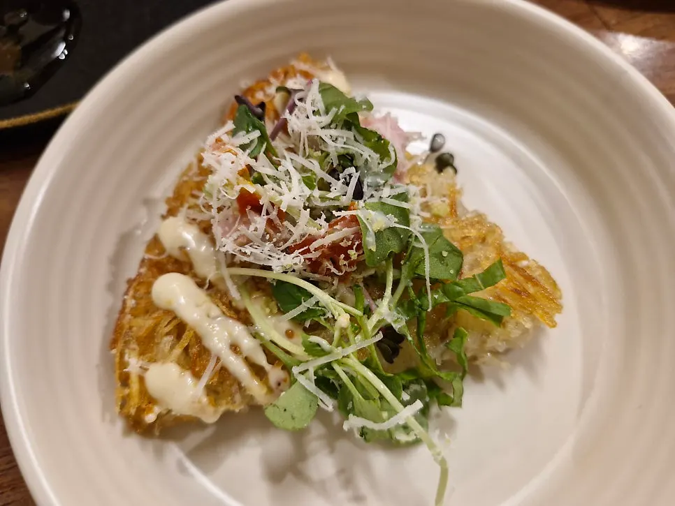 Spring potato pancake topped with sauces and toppings
