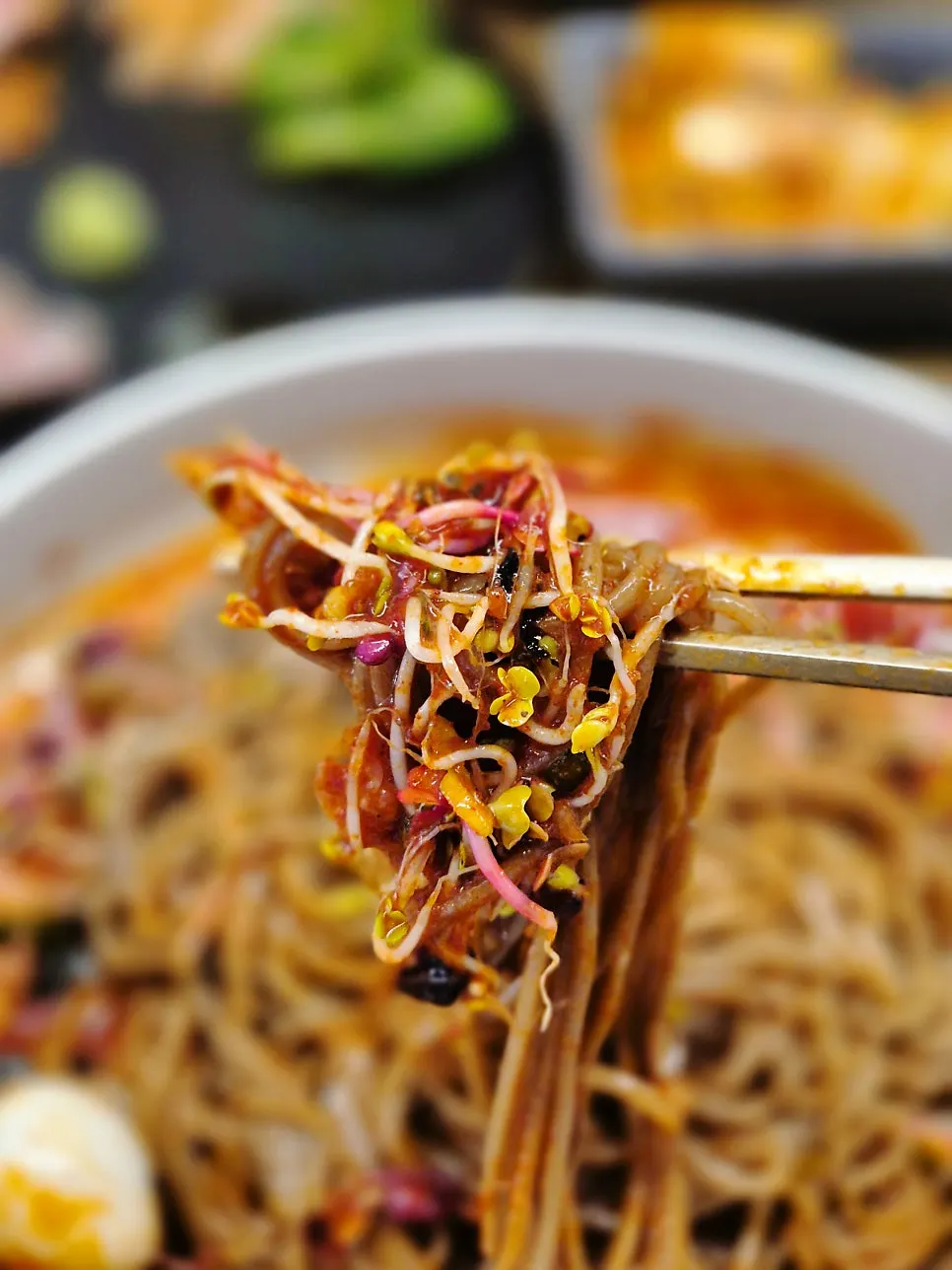 Close-up of buckwheat noodles tossed in sauce