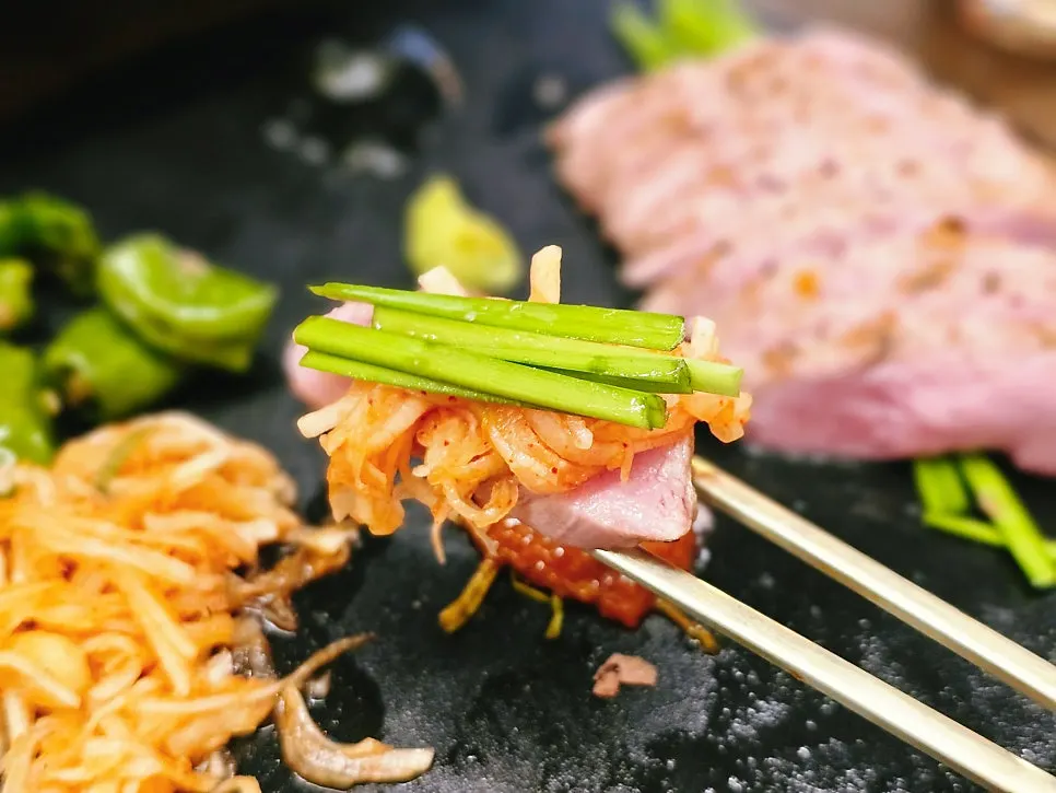 Pork tenderloin served with fresh kimchi