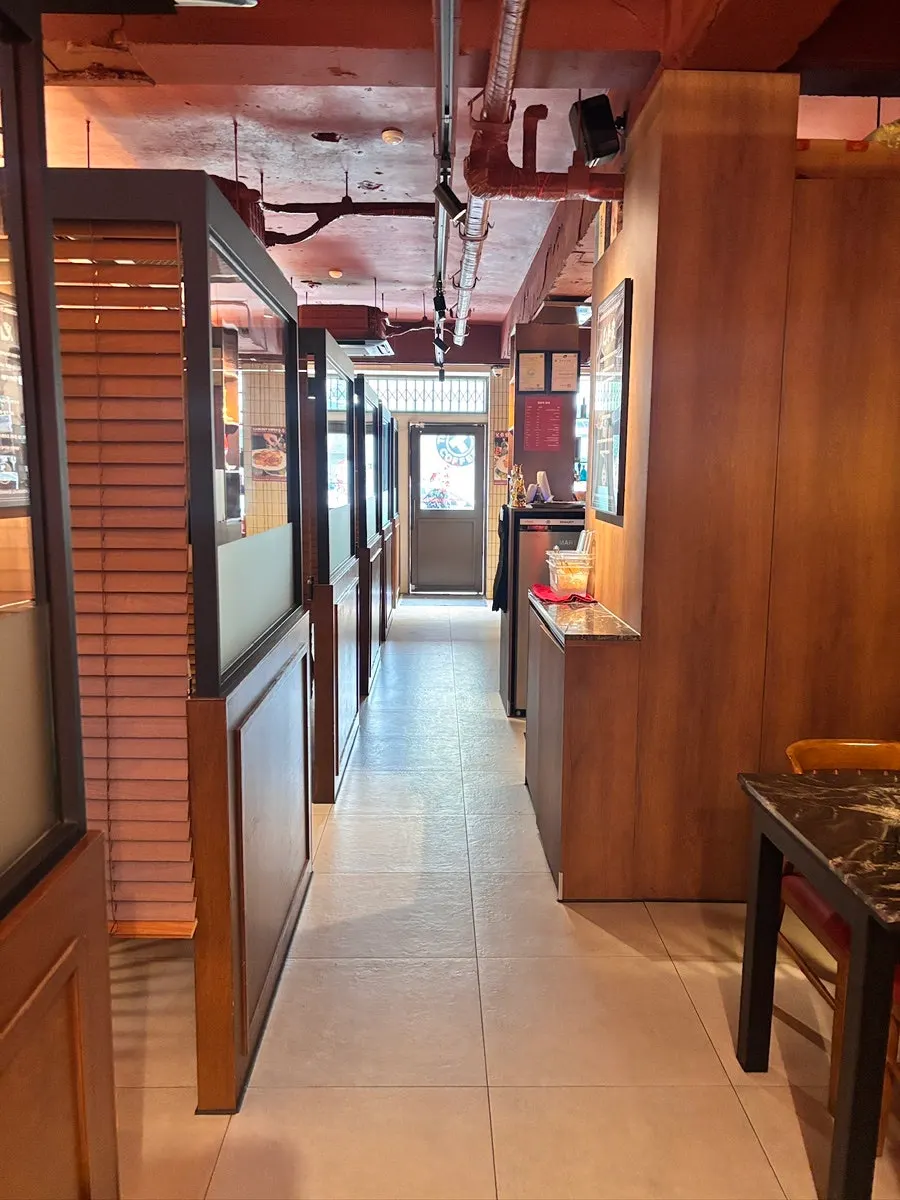 Private hallway leading to the room-style interior