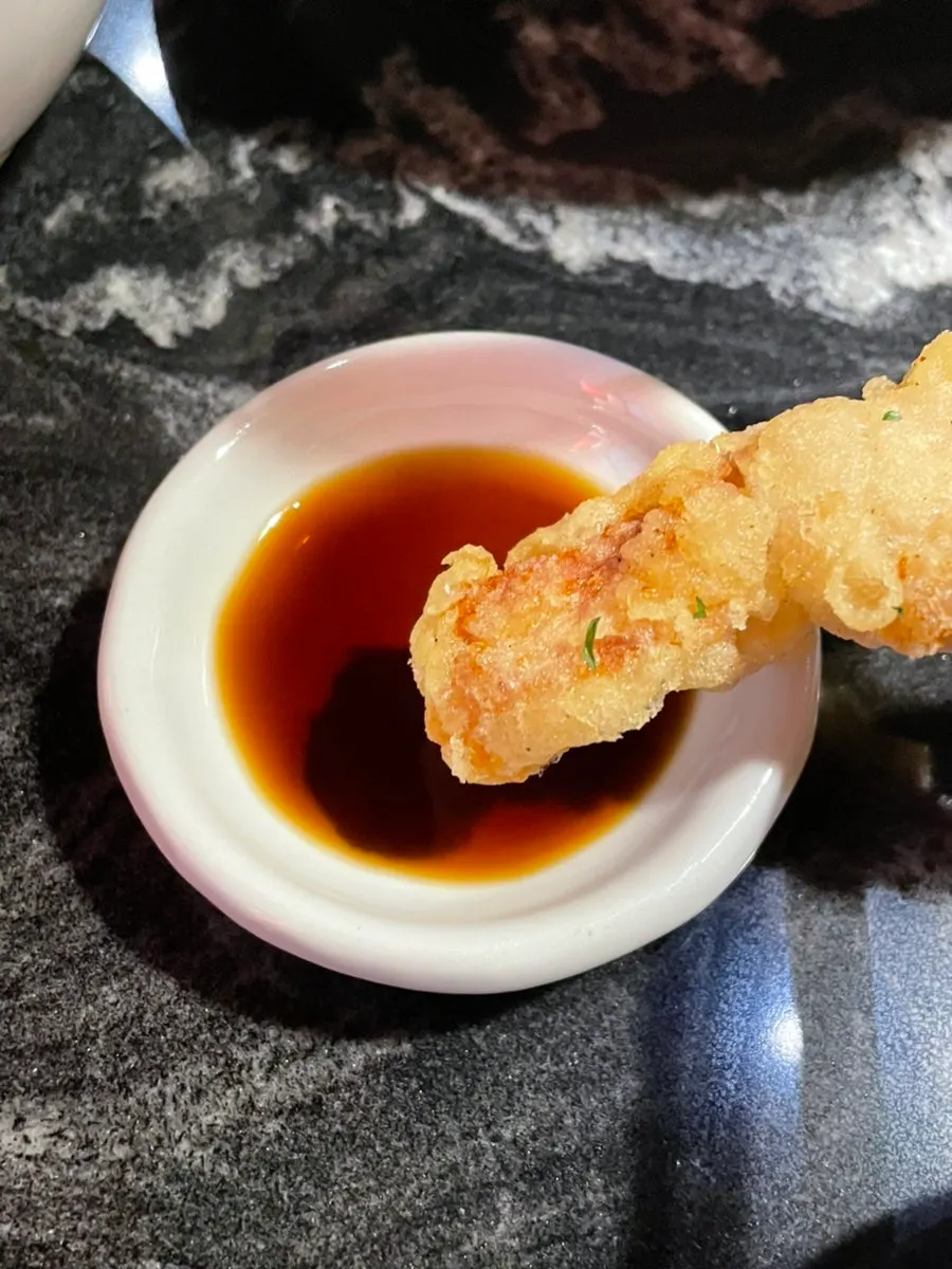 Sweet and sour pork dipped in vinegar soy sauce