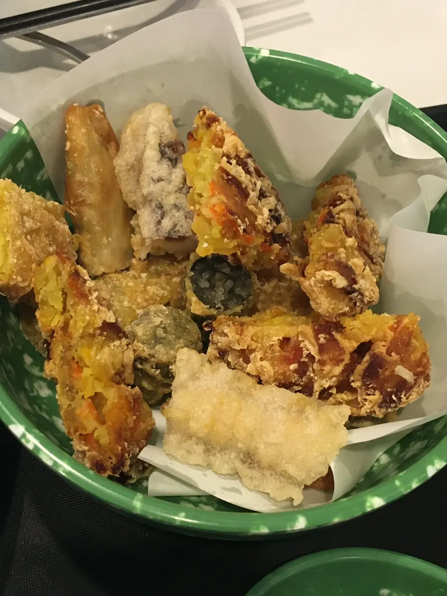 Sundae dipped into tteokbokki sauce