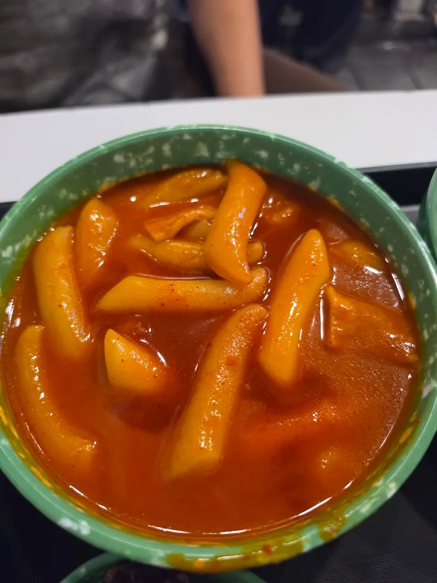 Chewy wheat rice cake tteokbokki coated in medium-spice sauce