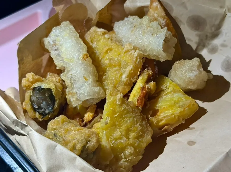 Assorted fried snacks including glass noodle roll and sweet potato