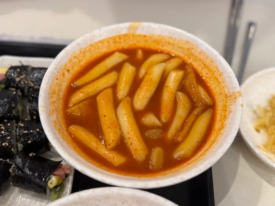 The full combo set with tteokbokki, odeng, fritters, sundae, and mini gimbap
