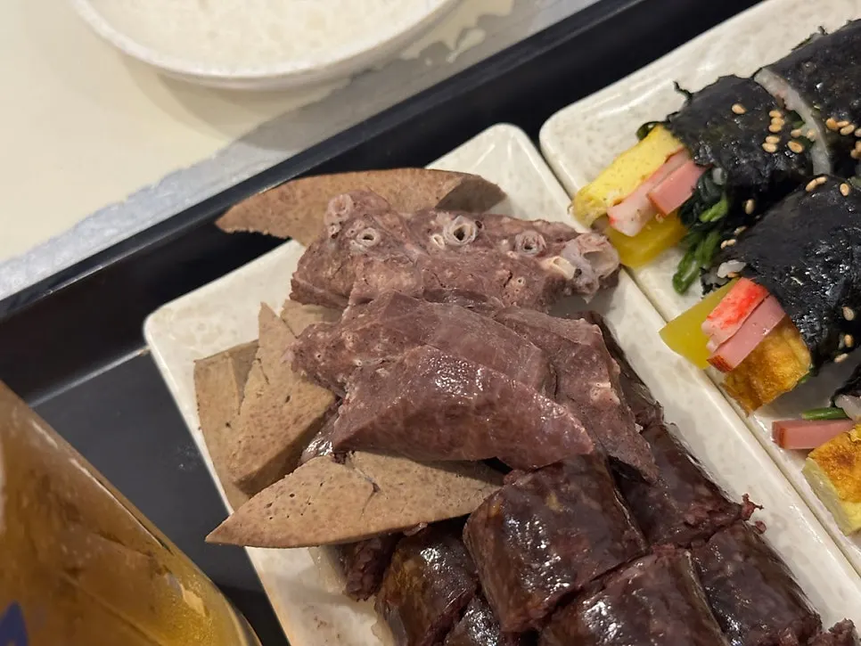 Mini gimbap plated together with tteokbokki