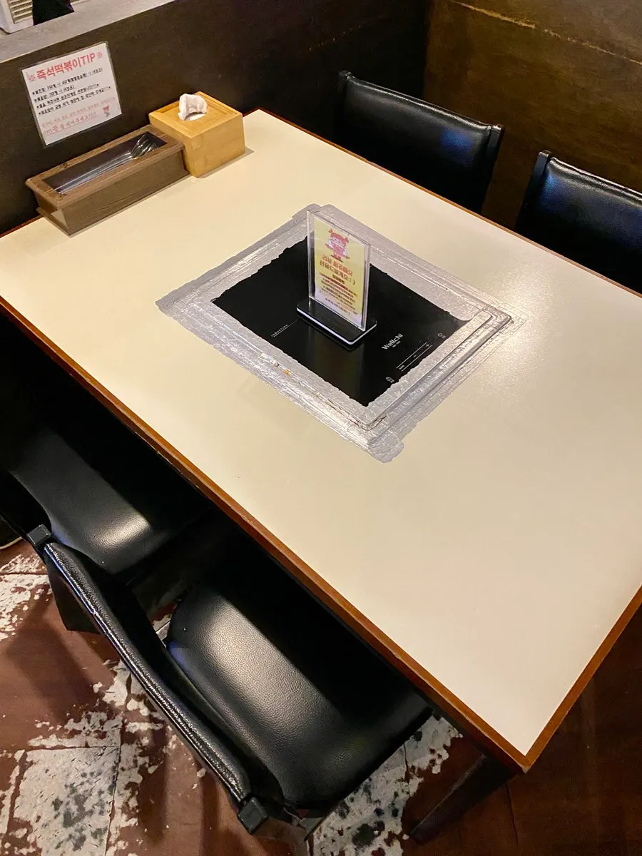 Table seating at Hyeonseonine with an induction burner